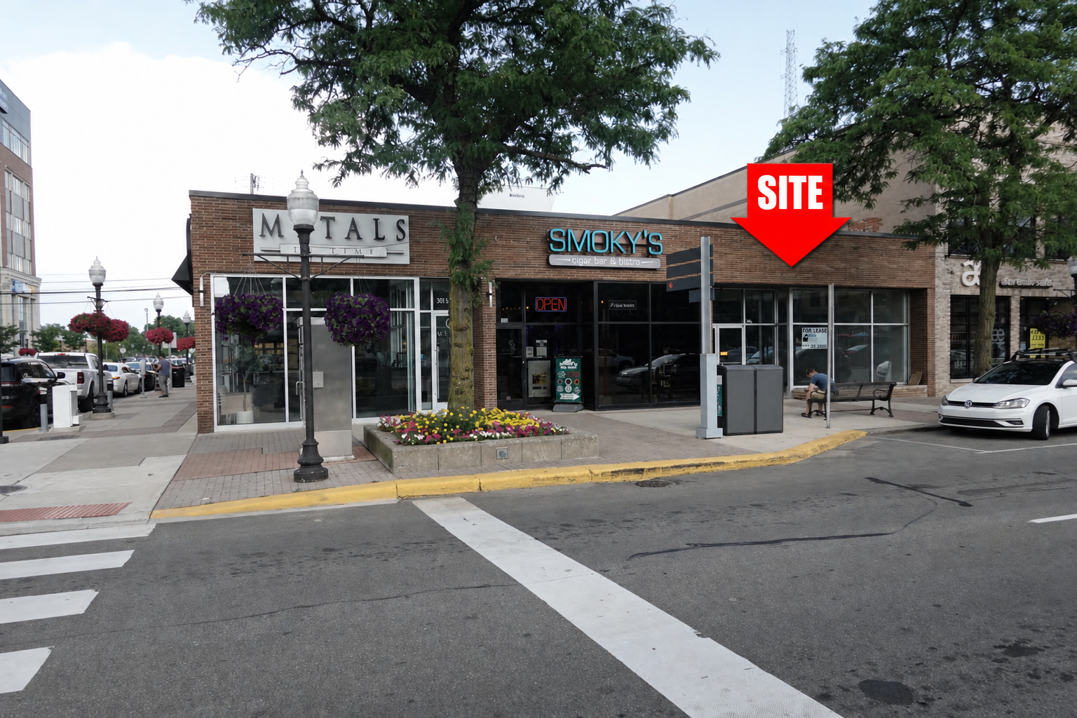Storefront at 305 South Main Street in Downtown Royal Oak, Michigan, with a red SITE arrow identifying the available space